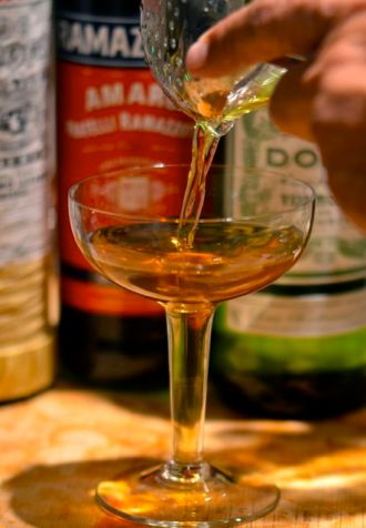 Pouring a Brooklyn cocktail.